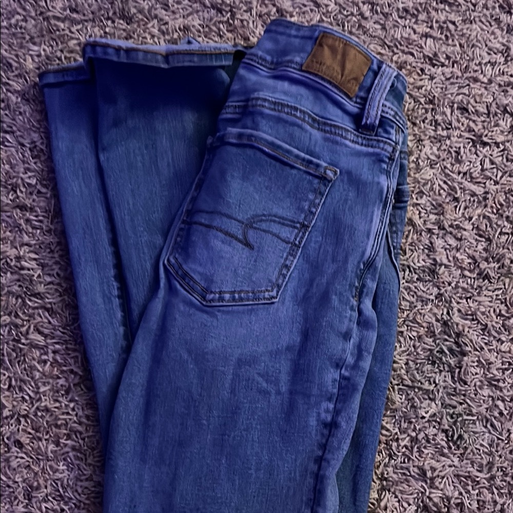 Blue Boot Cut Jeans with Subtle Fading